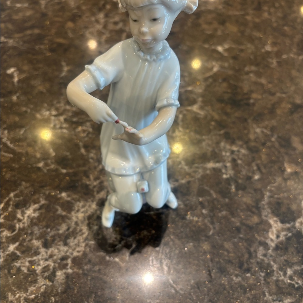 Lladro girl doing her nails